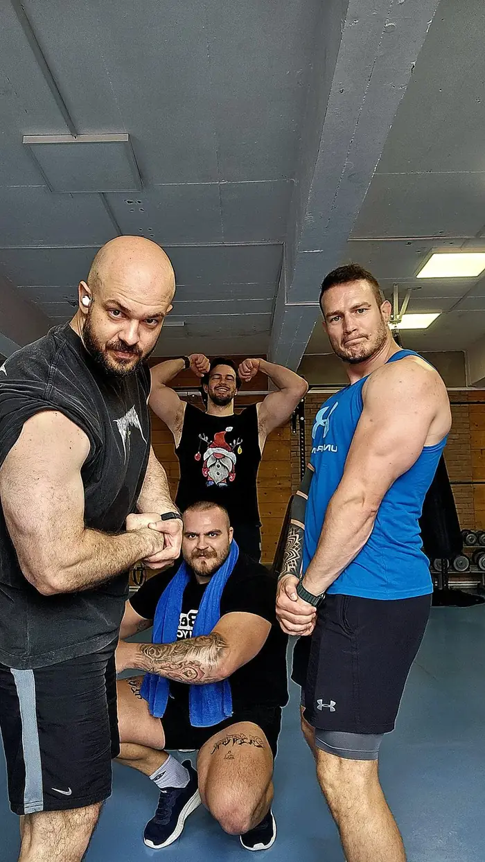 The crew flexing at the gym